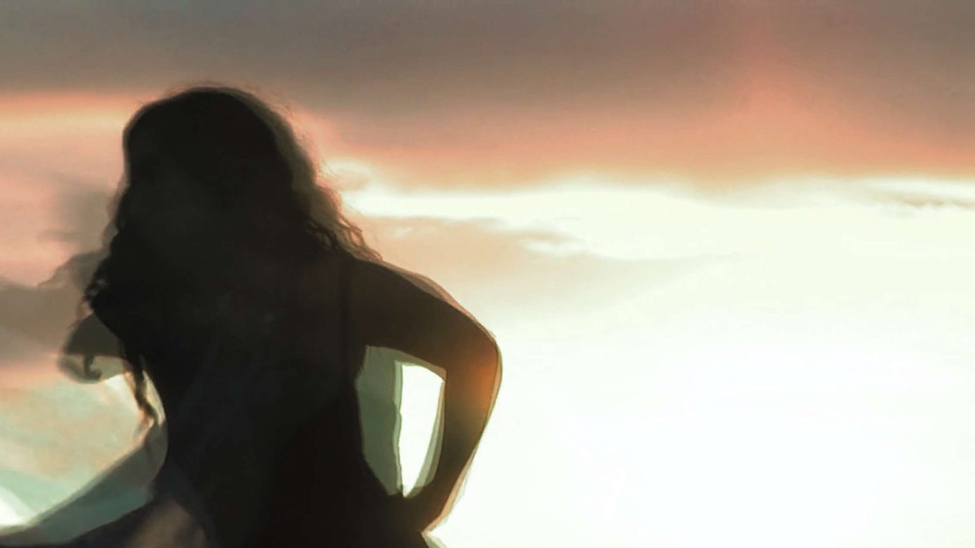 Sara in silhouette at dusk